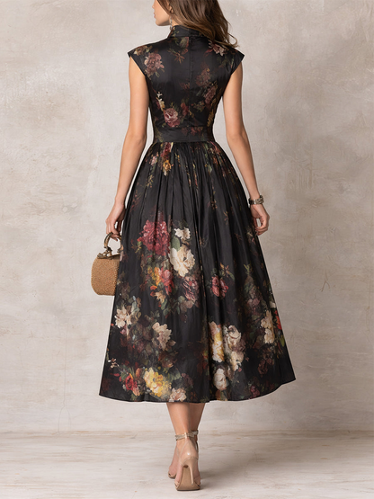 Violetta - Vestido midi negro de satén plisado con estampado floral y escote con abertura.